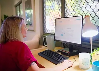 Sue works on her computer.
