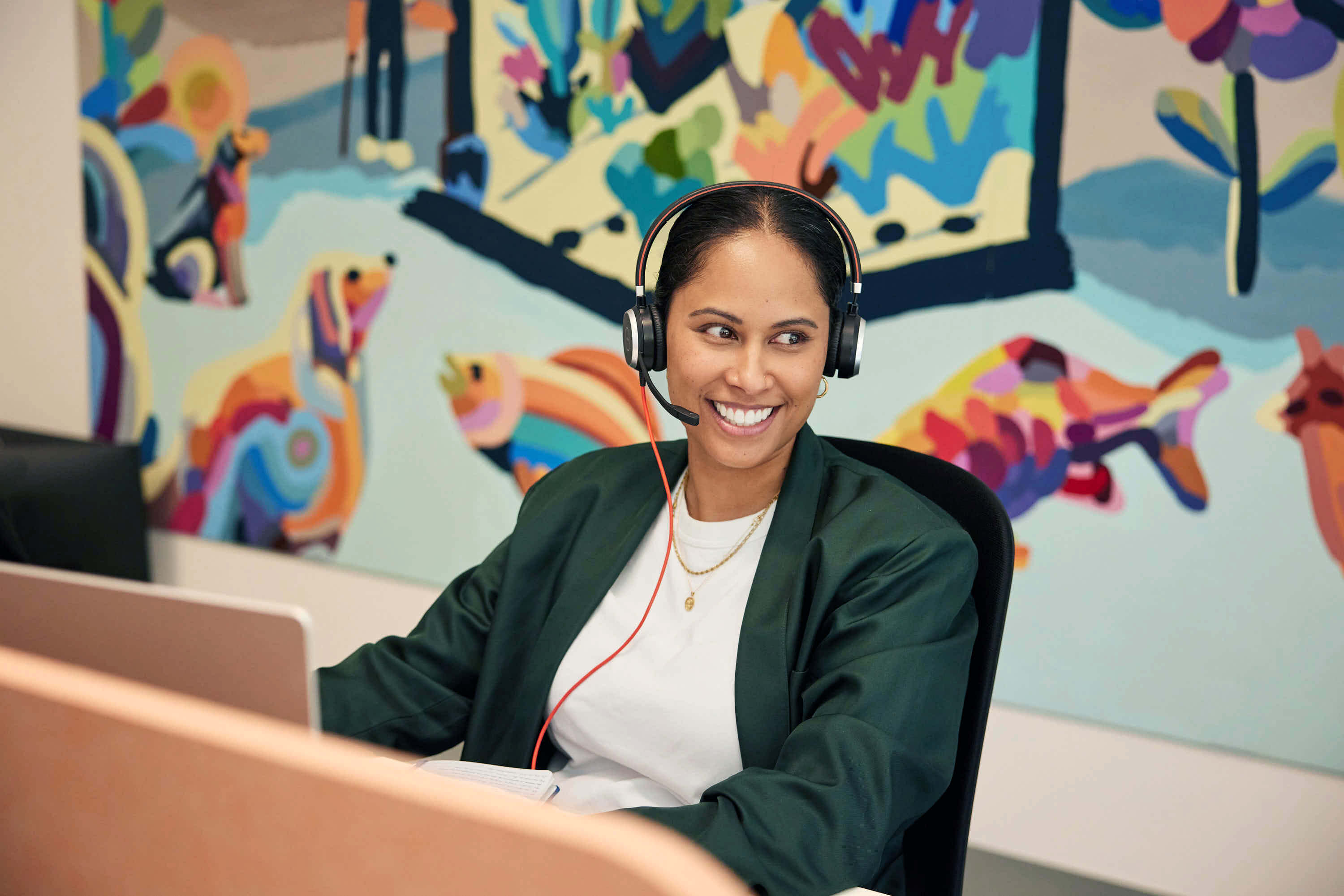 HomeMade staff member smiling with a headset on